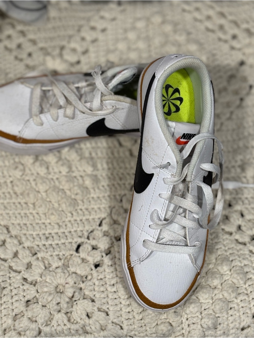 Nike White Low-Top Sneakers with Black Swoosh and Brown Accent